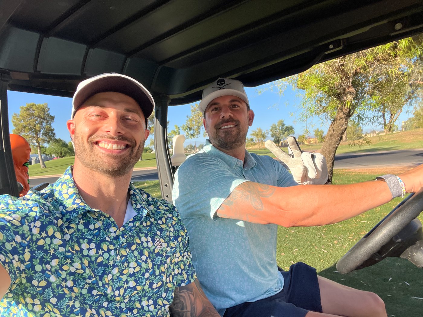 Justin and Andrew in a golf cart