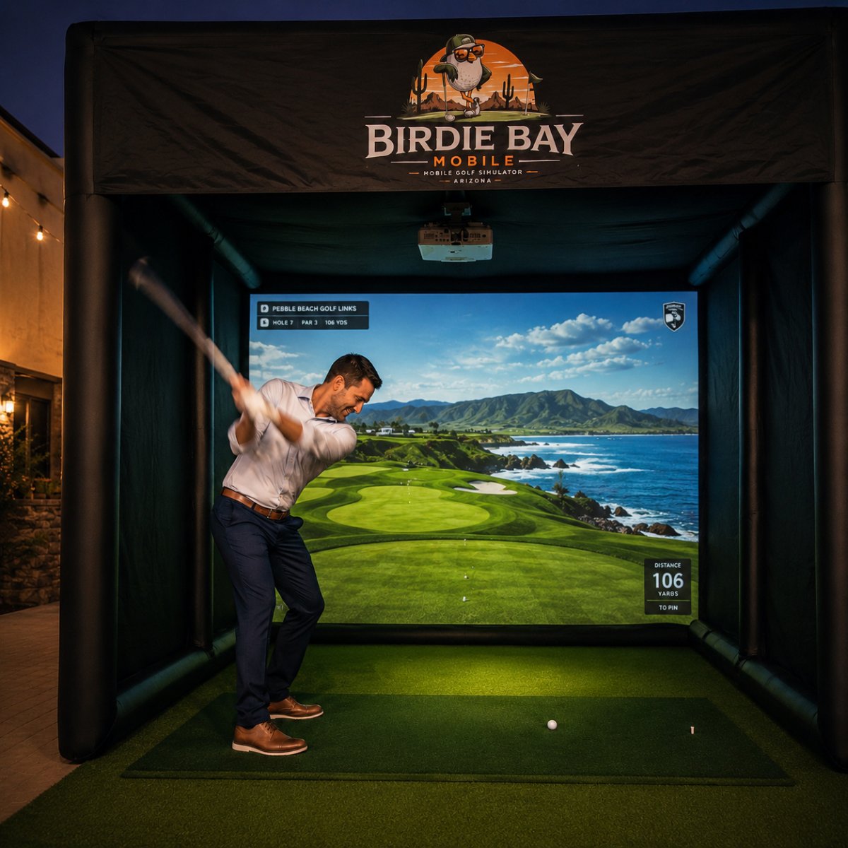 Event guest mid-swing on hole 7 at Pebble Beach inside the Birdie Bay Mobile golf simulator bay in Arizona