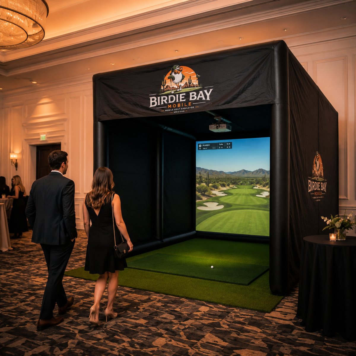 Couple walking up to the Birdie Bay Mobile golf simulator at a Scottsdale wedding cocktail hour in an elegant ballroom